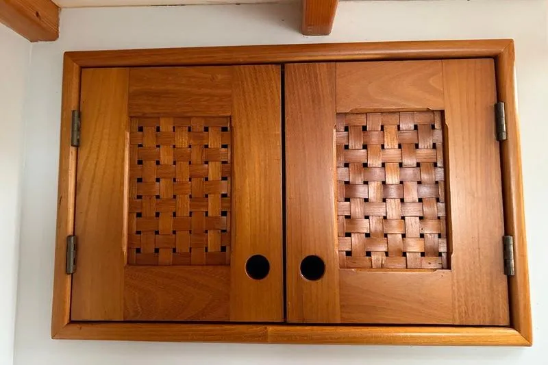 Slide: The Image of Wooden cabinet with woven panel doors on a 1993 Brooklin Boat Yard Marshall 48. - 42