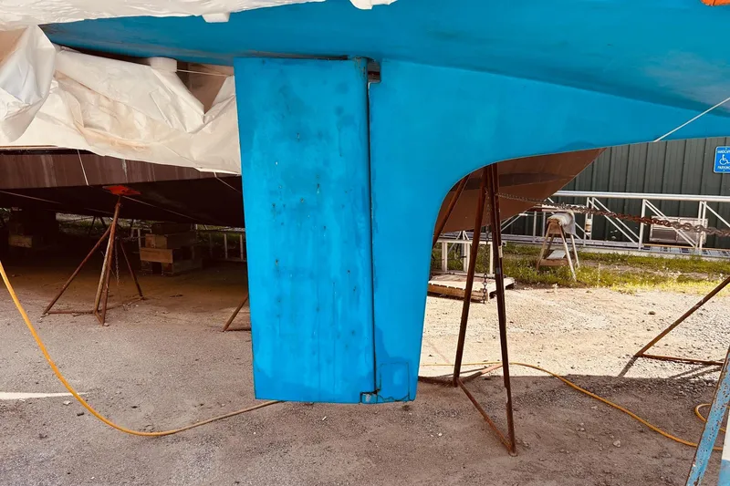 Slide: The Image of Blue hull of 1993 Brooklin Boat Yard Marshall 48 on stands. - 48