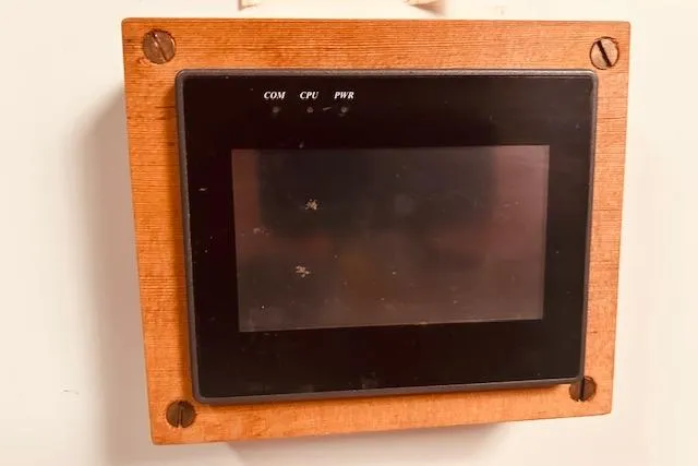 Slide: The Image of Wooden-framed control panel on 1993 Brooklin Boat Yard Marshall 48. - 51