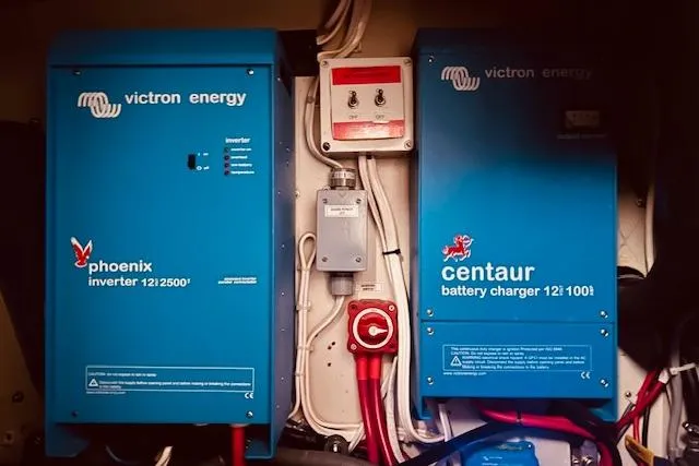 Slide: The Image of Victron Energy Phoenix inverter and Centaur battery charger on a 1993 Brooklin Boat Yard Marshall 48. - 53
