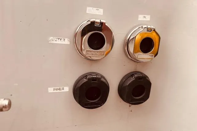 Slide: The Image of Control panel with labeled outlets on a 1993 Brooklin Boat Yard Marshall 48. - 55
