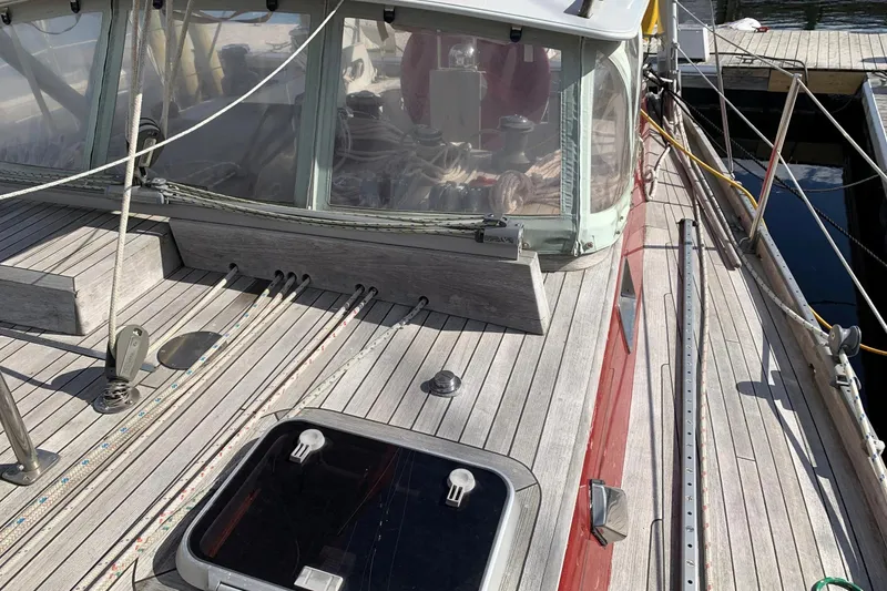 Slide: The Image of Deck view of 1993 Brooklin Boat Yard Marshall 48 sailboat, featuring wooden finish and rigging. - 57