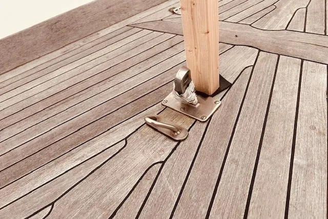 Slide: The Image of Teak deck of 1993 Brooklin Boat Yard Marshall 48 with metal fittings. - 68