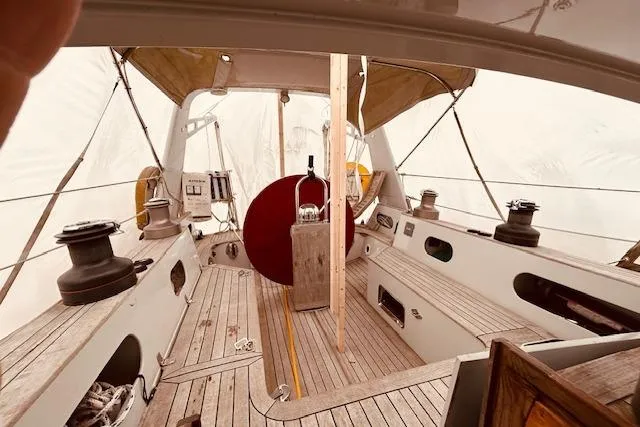 Slide: The Image of Interior view of 1993 Brooklin Boat Yard Marshall 48 sailboat, showcasing wooden deck and equipment. - 73