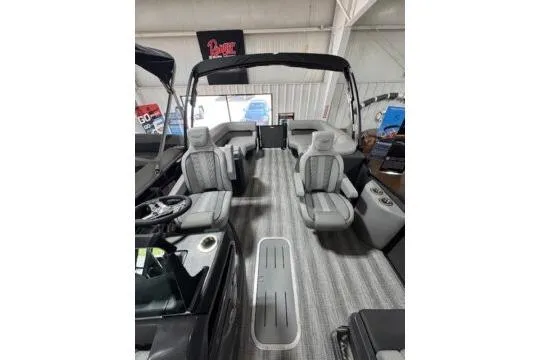 Slide: The Image of 2025 Bennington 22M FASTBACK boat interior with modern seating and sleek design. - 5