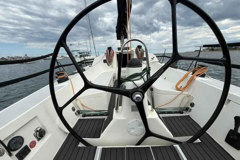 Slide: The Image of Cockpit view of 2013 J Boats J/122 sailboat with dual steering wheels and nautical equipment. - 16