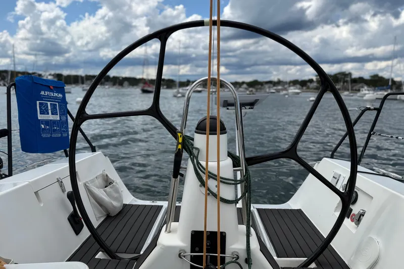 Slide: The Image of Cockpit view of 2013 J Boats J/122 sailboat with steering wheel and lifebuoy. - 17