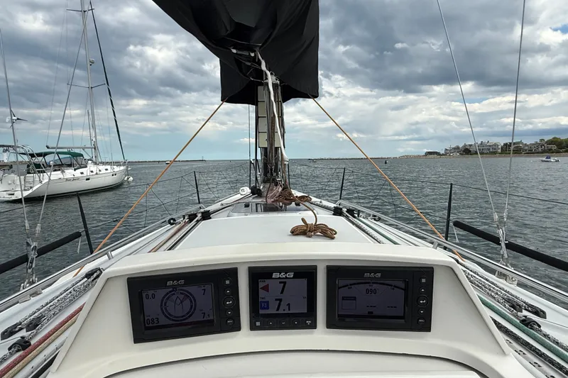 Slide: The Image of 2013 J Boats J/122 sailboat cockpit with navigation instruments, sailing on a cloudy day. - 25