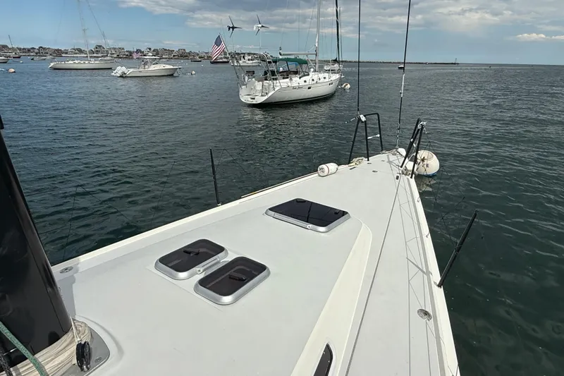 Slide: The Image of Sailing yacht J Boats J/122, 2013 model, anchored in a serene harbor. - 26