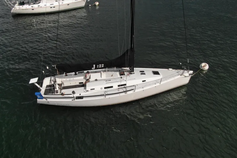 Slide: The Image of 2013 J Boats J/122 sailboat moored on calm water, aerial view. - 3