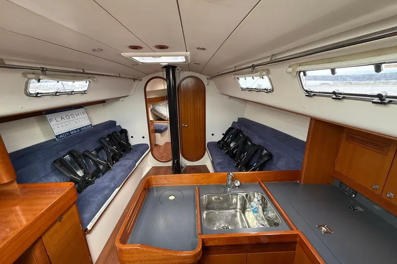 Slide: The Image of Interior of 2013 J Boats J/122 sailboat with seating, sink, and storage. - 31