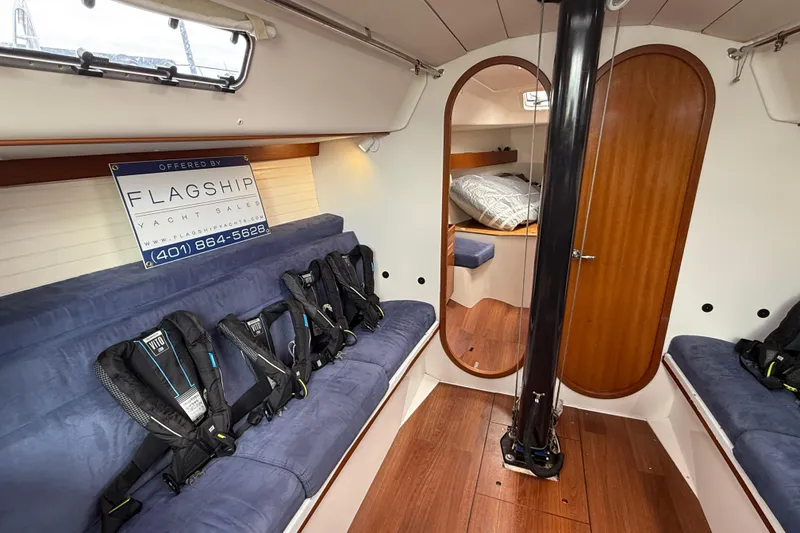 Slide: The Image of Interior of 2013 J Boats J/122 yacht with seating and life vests. - 32
