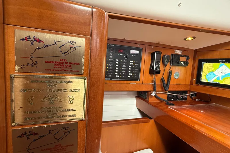 Slide: The Image of Interior of 2013 J Boats J/122 with race plaques and navigation equipment. - 38