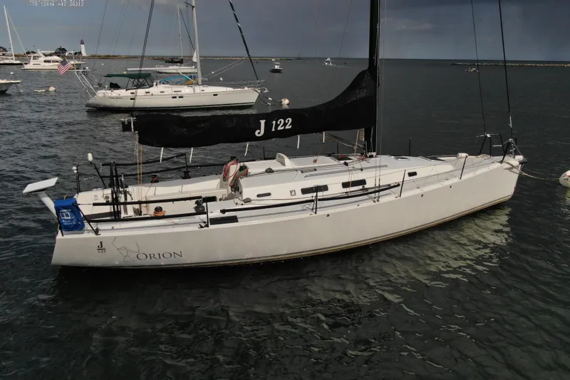 Slide: The Image of 2013 J Boats J/122 sailboat named Orion moored in a harbor. - 4