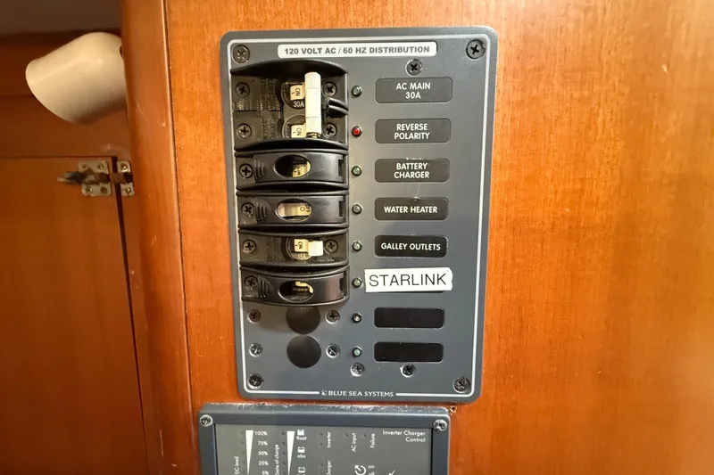 Slide: The Image of Electrical panel on 2013 J Boats J/122, featuring AC distribution and Starlink label. - 42