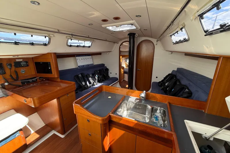 Slide: The Image of Interior of 2013 J Boats J/122 sailboat with wood finish and modern amenities. - 47
