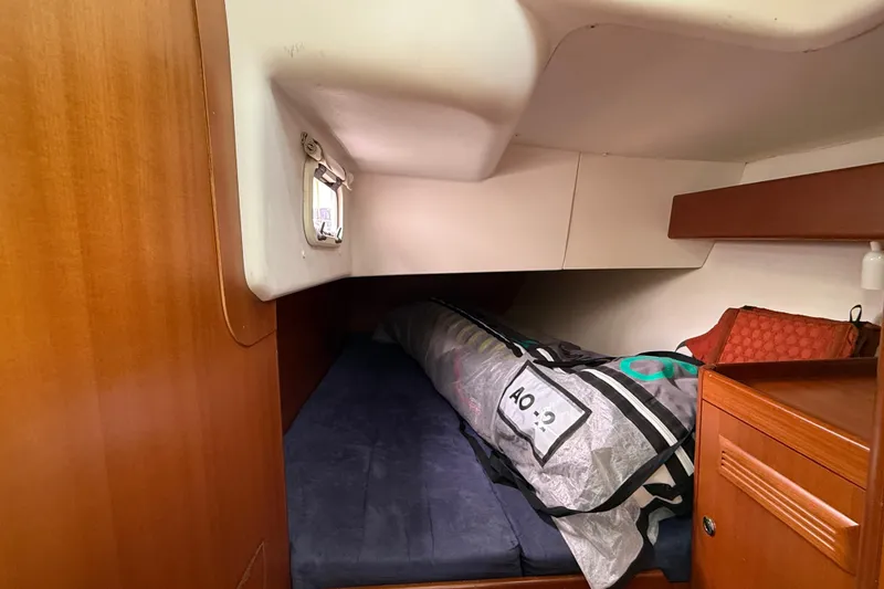 Slide: The Image of Cozy cabin interior of 2013 J Boats J/122 with wooden accents and storage. - 48