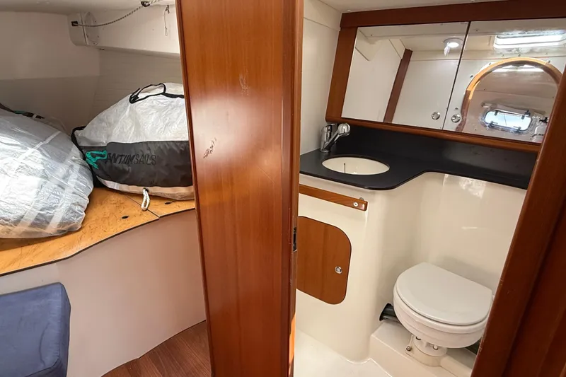 Slide: The Image of 2013 J Boats J/122 interior with bathroom and sail storage area. - 50