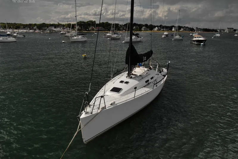 Slide: The Image of Sailboat J Boats J/122 2013 anchored in a scenic harbor with other boats. - 8