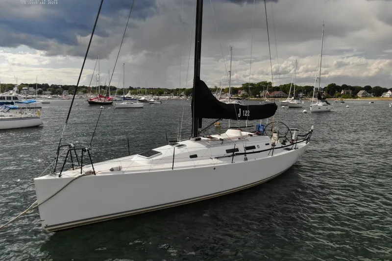 Slide: The Image of 2013 J Boats J/122 sailboat anchored in a scenic harbor. - 9