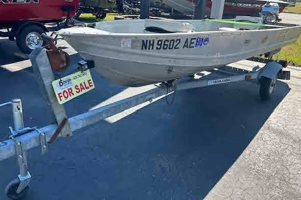 Slide: The Image of 1972 Sea Nymph 140 Angler boat on trailer, for sale sign visible. - 3