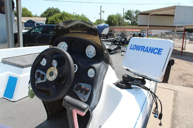 Slide: The Image of 2006 Nitro NX 750 boat dashboard with steering wheel and Lowrance navigation system. - 11
