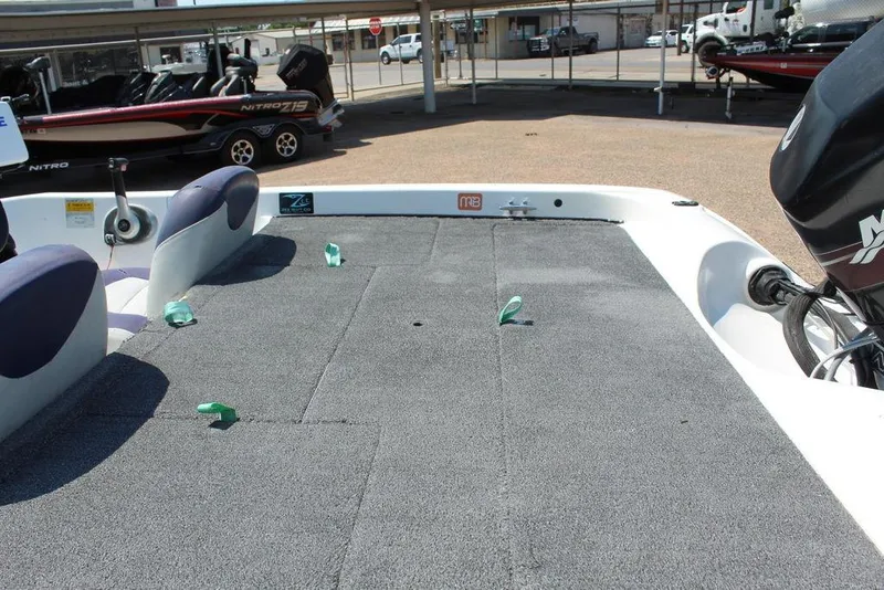 Slide: The Image of 2006 Nitro NX 750 boat interior with carpeted deck and seating. - 14