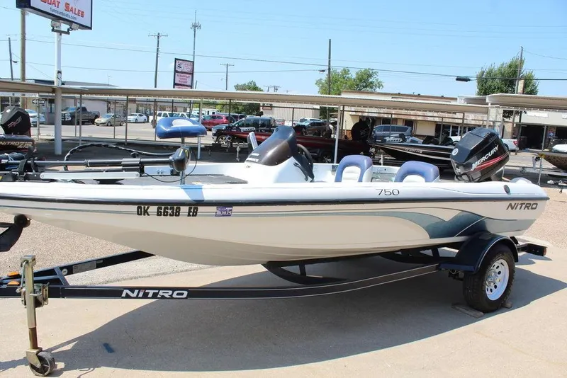 Slide: The Image of 2006 Nitro NX 750 boat on trailer at dealership, featuring Mercury outboard motor. - 3