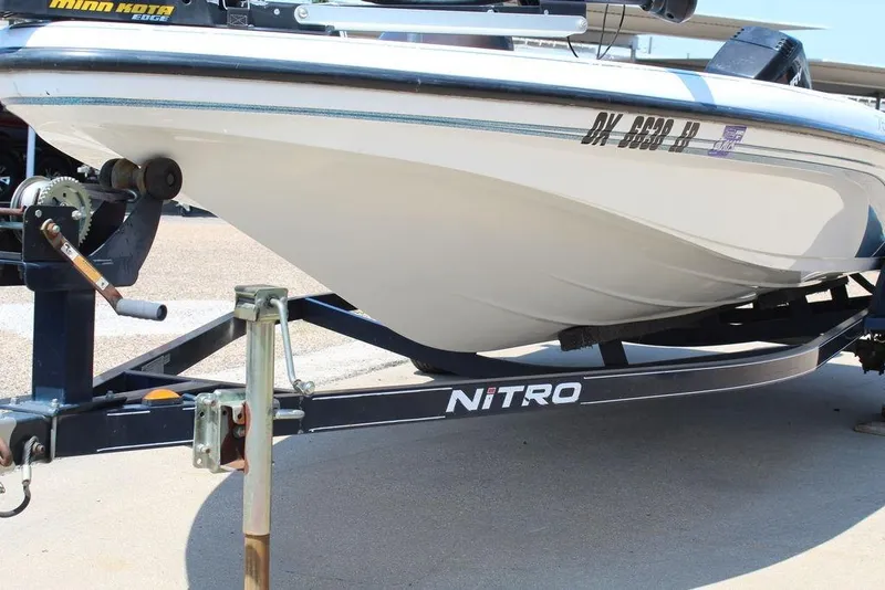 Slide: The Image of 2006 Nitro NX 750 boat on trailer, featuring Minn Kota Edge trolling motor. - 5