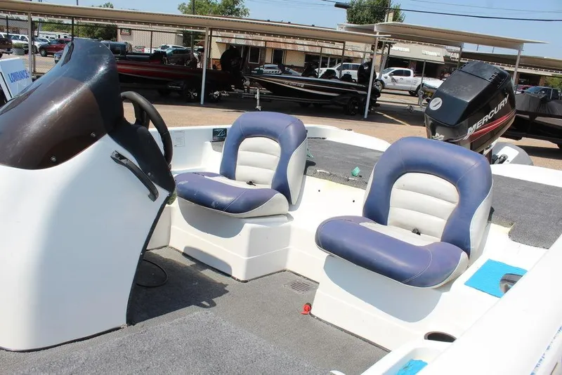 Slide: The Image of 2006 Nitro NX 750 boat interior with dual blue seats and Mercury outboard motor. - 6