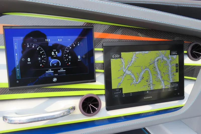 Slide: The Image of Dashboard of 2022 MTI 48 boat with digital displays and navigation system. - 11