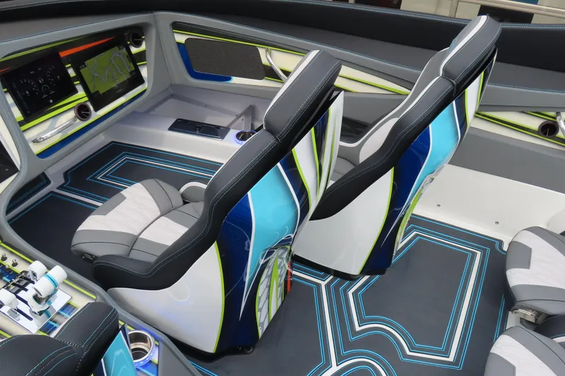 Slide: The Image of Interior of 2022 MTI 48 boat with modern seats and navigation display. - 14