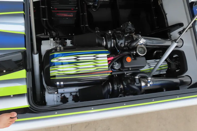 Slide: The Image of Engine compartment of 2022 MTI 48 boat with colorful detailing and mechanical components. - 20