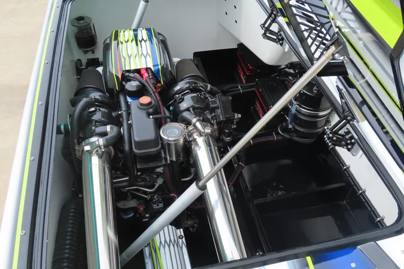 Slide: The Image of Engine compartment of a 2022 MTI 48 boat, showcasing dual engines and sleek design. - 21