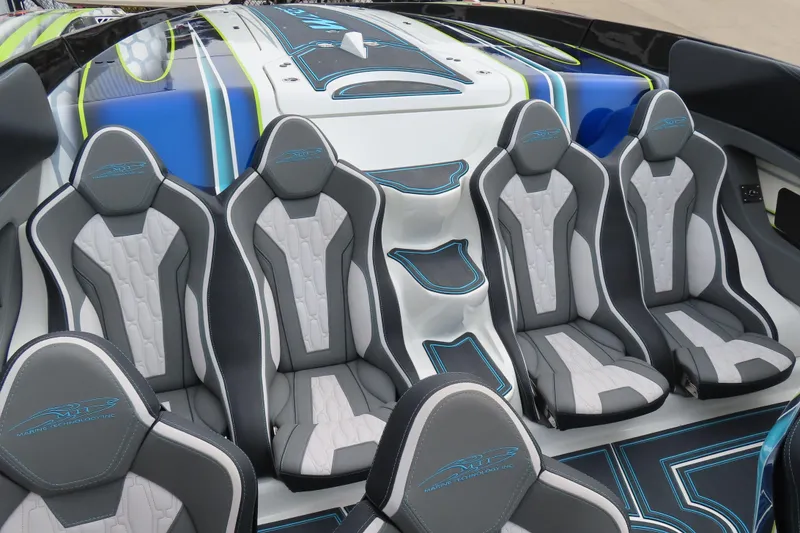 Slide: The Image of Luxury seating in 2022 MTI 48 boat, featuring sleek design and modern upholstery. - 27