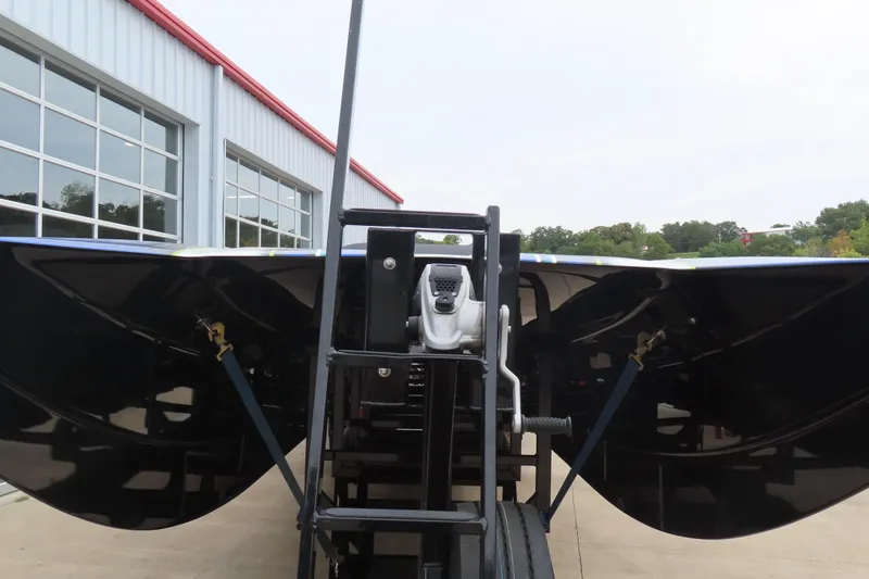 Slide: The Image of 2022 MTI 48 boat on trailer near industrial building. - 34