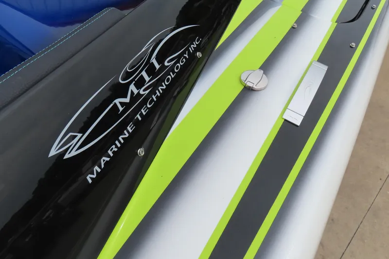 Slide: The Image of MTI 48 boat, 2022 model, featuring sleek black and neon green design. - 5