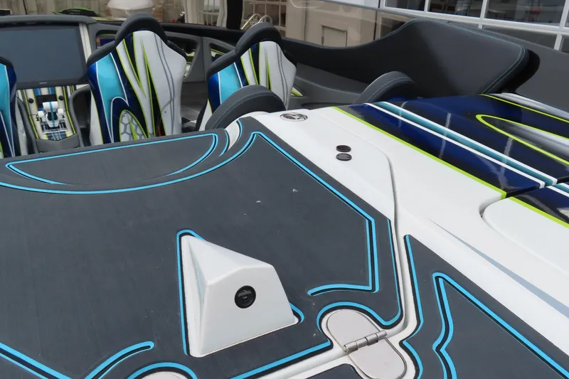 Slide: The Image of 2022 MTI 48 boat interior with modern design and vibrant seating. - 7