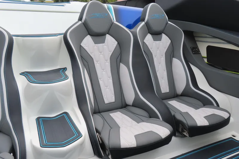 Slide: The Image of Luxury seating in a 2022 MTI 48 boat, featuring sleek gray and white design. - 9
