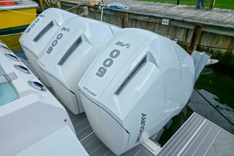 Slide: The Image of Triple Mercury 600 V12 outboard engines on a 2025 Regal 50 SAV boat. - 11