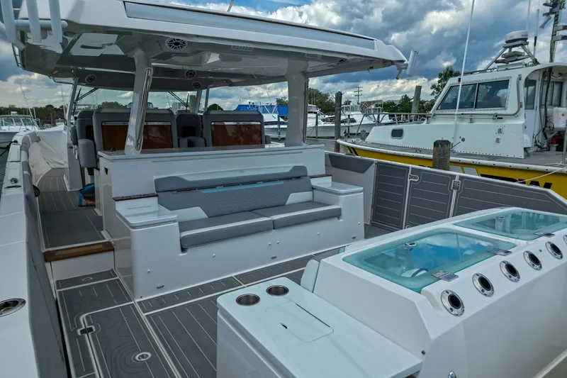 Slide: The Image of 2025 Regal 50 SAV luxury yacht interior with seating and modern amenities. - 12