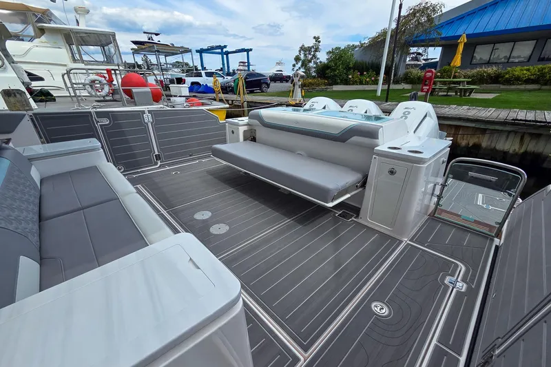 Slide: The Image of Luxurious 2025 Regal 50 SAV boat deck with modern seating and sleek design. - 15