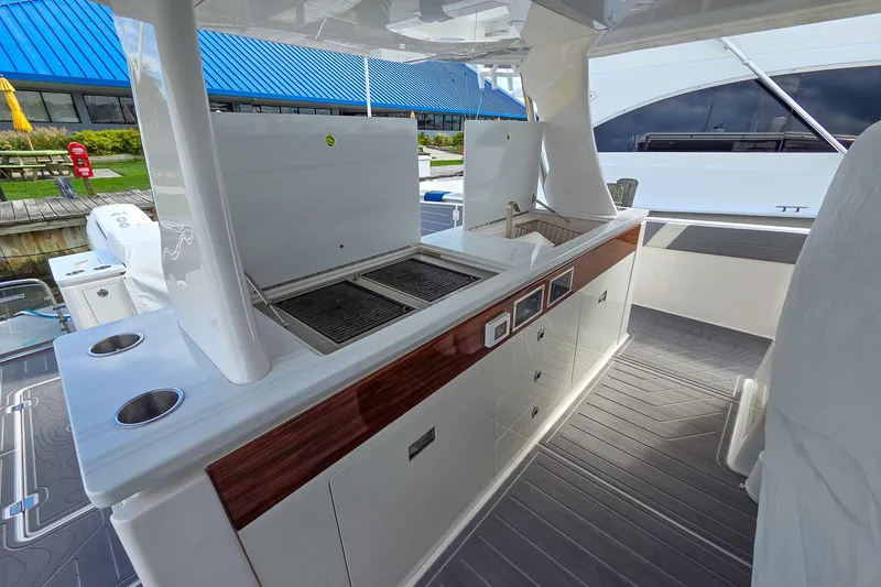 Slide: The Image of Outdoor kitchen on 2025 Regal 50 SAV yacht with grill and sink. - 19