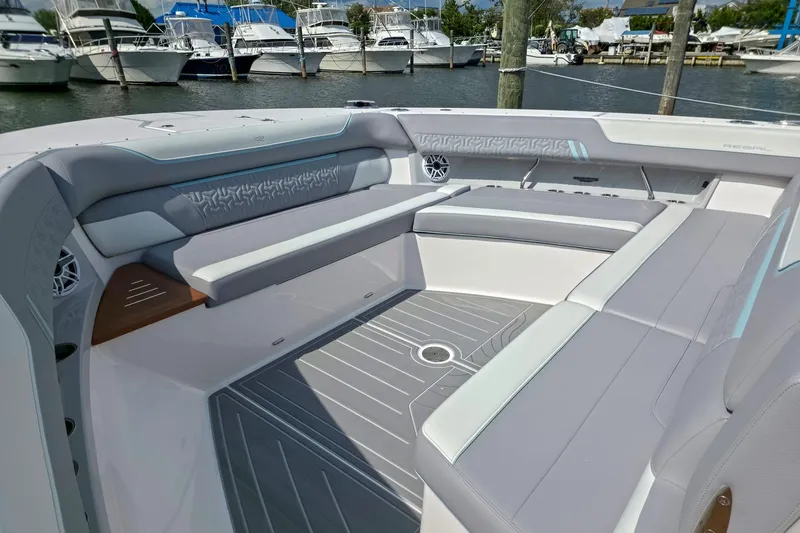 Slide: The Image of Luxurious seating area on 2025 Regal 50 SAV boat, docked at marina. - 22