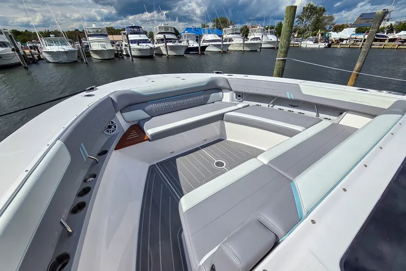 Slide: The Image of Luxurious 2025 Regal 50 SAV boat interior with spacious seating at marina. - 23