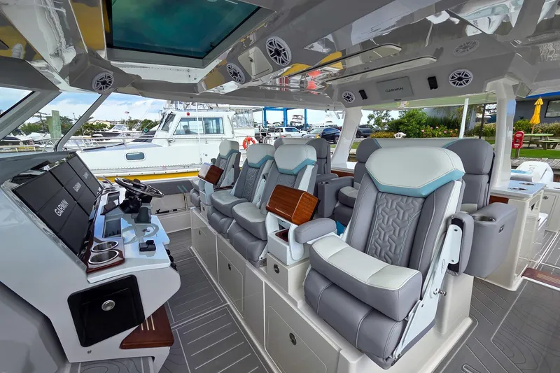Slide: The Image of Luxurious interior of 2025 Regal 50 SAV yacht with plush seating and advanced navigation systems. - 27