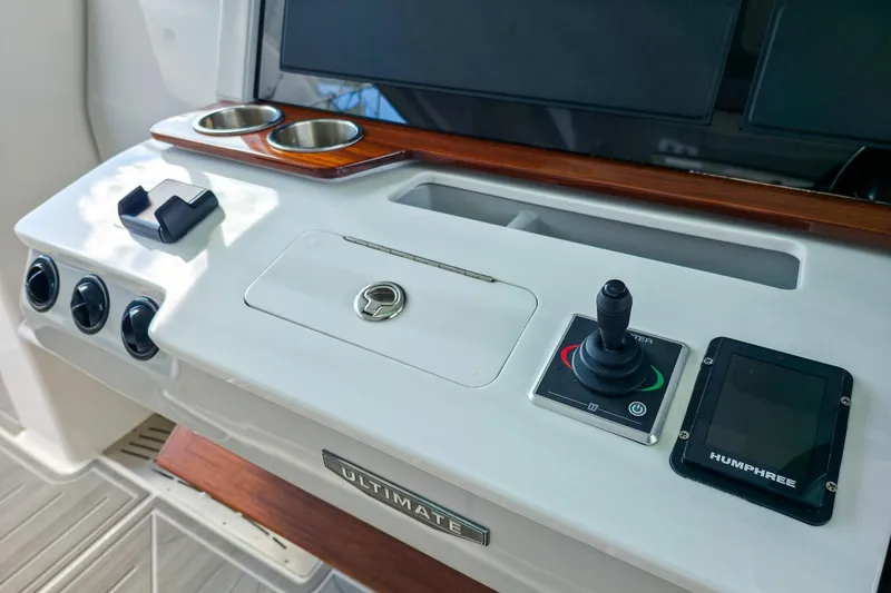 Slide: The Image of Control panel of 2025 Regal 50 SAV boat with joystick and display. - 33