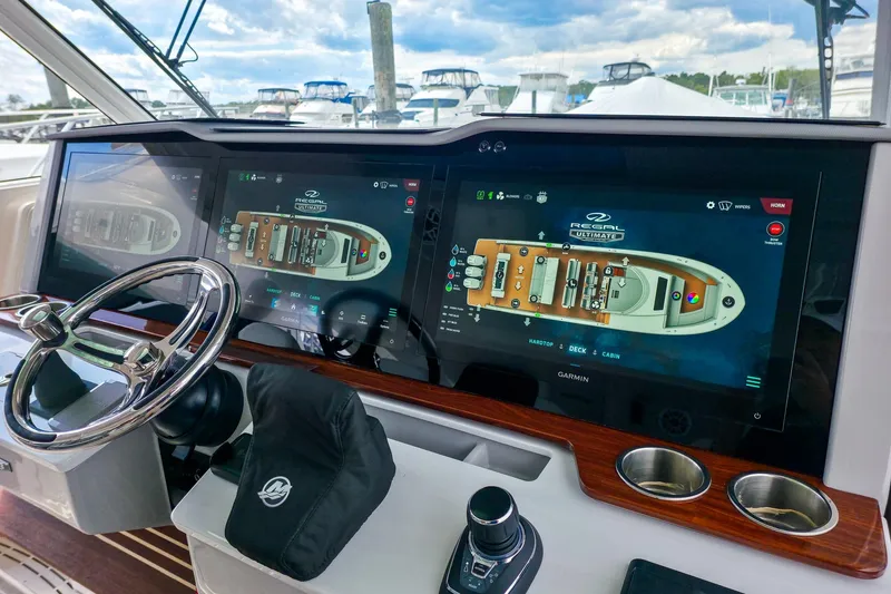 Slide: The Image of Helm of 2025 Regal 50 SAV yacht with advanced navigation displays. - 40