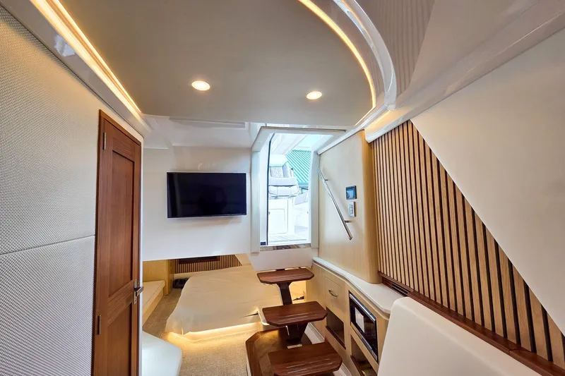 Slide: The Image of Luxurious interior of 2025 Regal 50 SAV yacht with modern design and wood accents. - 43