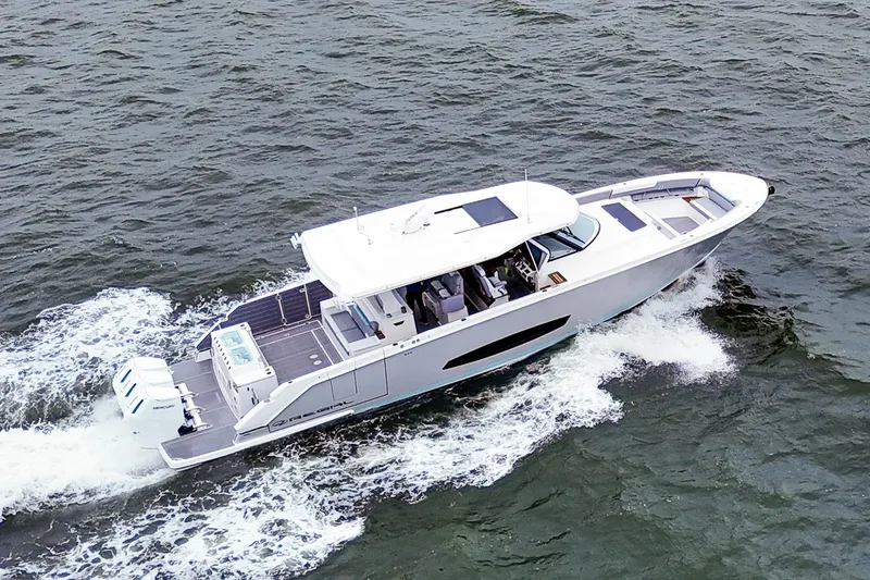 Slide: The Image of 2025 Regal 50 SAV yacht cruising on open water, showcasing sleek design and powerful engines. - 7